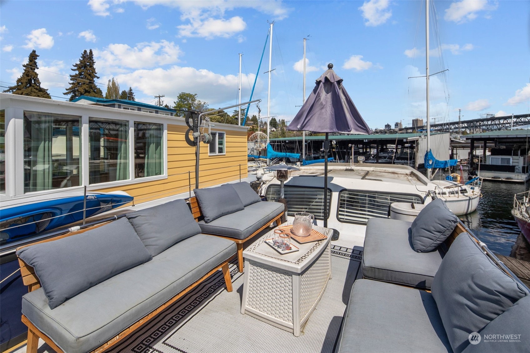 2401 North Northlake Way, Unit E6 Seattle, WA 98103 - Photo 18 of 25 a view of a patio with couches chairs and a table