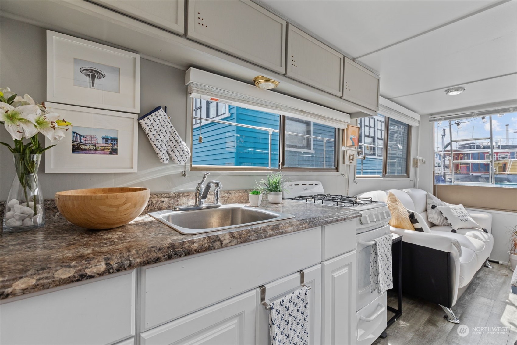 2401 North Northlake Way, Unit E6 Seattle, WA 98103 - Photo 7 of 25 a bathroom with a granite countertop sink and a window