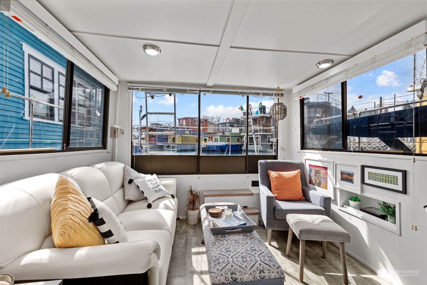 2401 North Northlake Way, Unit E6 Seattle, WA 98103 - Photo 8 of 25 a outdoor living space with furniture and a flat screen tv