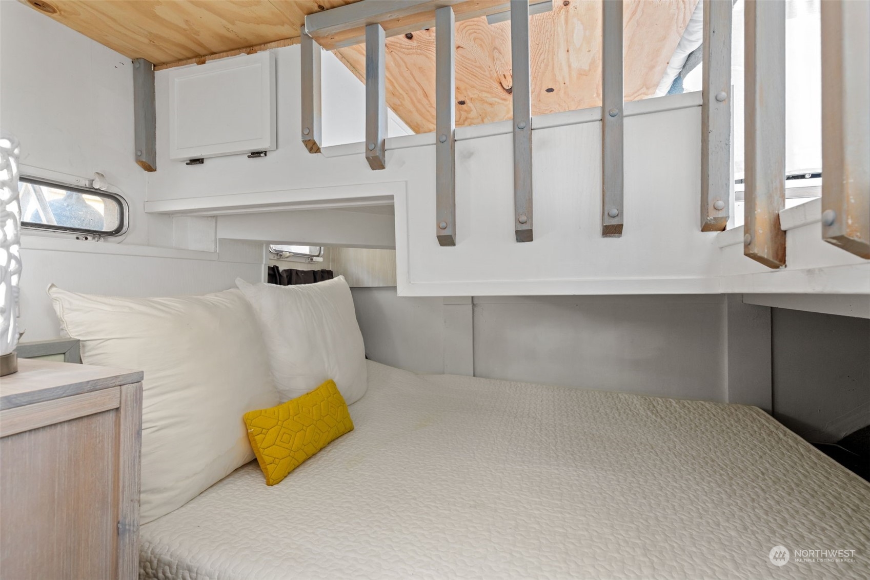 2401 North Northlake Way, Unit E6 Seattle, WA 98103 - Photo 10 of 25 a bathroom with a double vanity sink a mirror and a bathtub