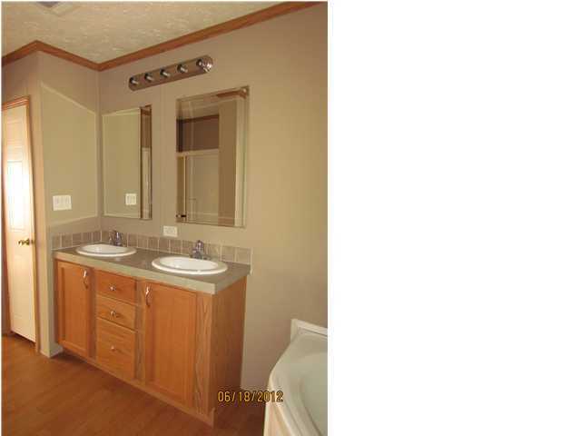 5825 Bush Road Baker, FL 32531 - Photo 13 of 27 a bathroom with a sink and a mirror