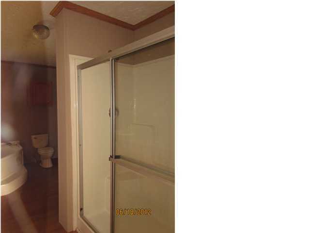 5825 Bush Road Baker, FL 32531 - Photo 15 of 27 a bathroom with a shower and a toilet