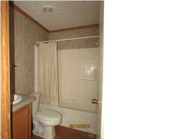 5825 Bush Road Baker, FL 32531 - Photo 18 of 27 a bathroom with a toilet and a shower