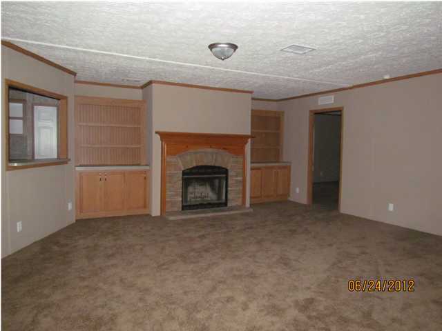 5825 Bush Road Baker, FL 32531 - Photo 2 of 27 a view of empty room with a fireplace