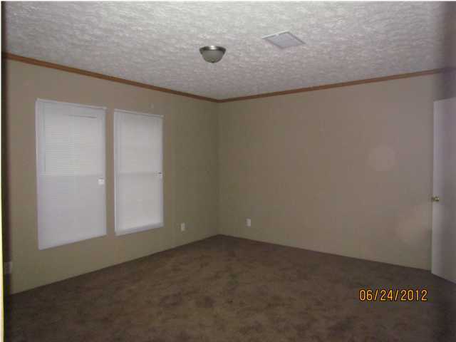 5825 Bush Road Baker, FL 32531 - Photo 25 of 27 an empty room with a workbench