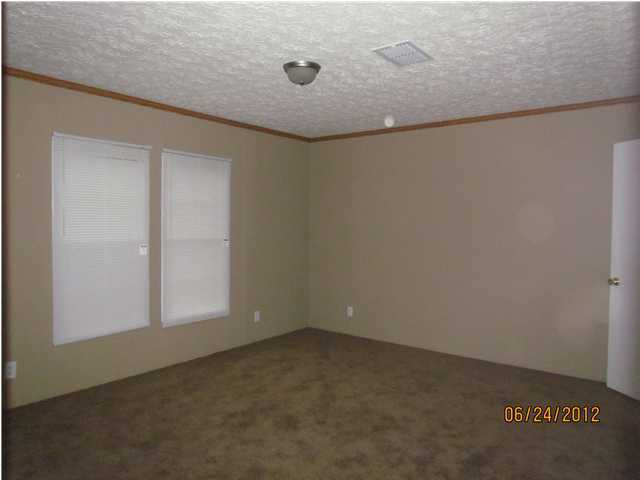 5825 Bush Road Baker, FL 32531 - Photo 26 of 27 an empty room with a workbench