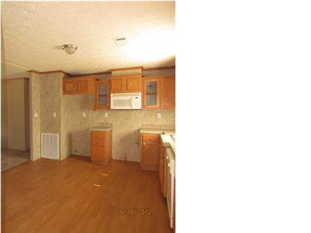 5825 Bush Road Baker, FL 32531 - Photo 9 of 27 a bathroom with a toilet