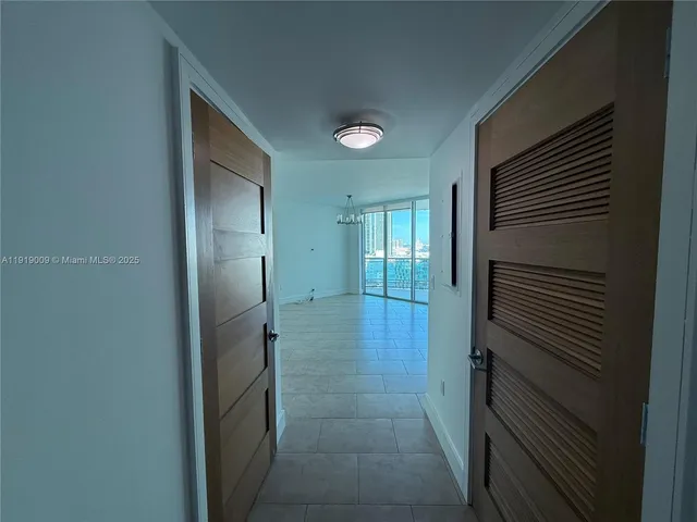 a bathroom with a shower and a sink