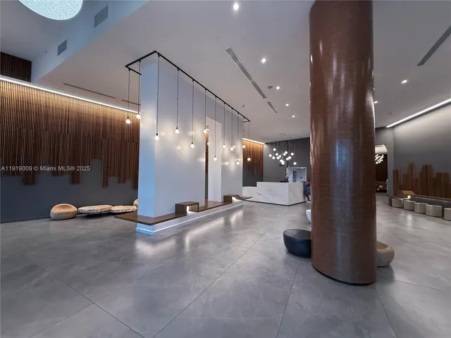 a living room with furniture and a bathroom