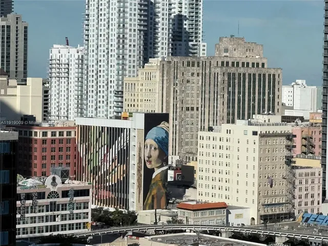 a kitchen with stove and cabinets