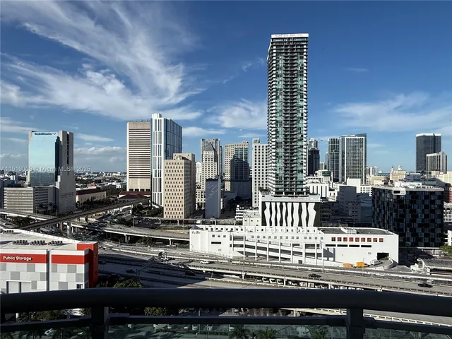 a kitchen with stainless steel appliances kitchen island granite countertop a stove and cabinets