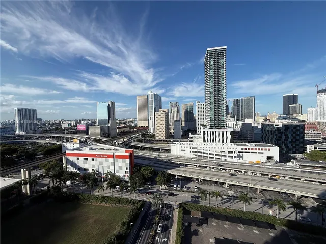 a living room with lots of furniture and a swimming pool
