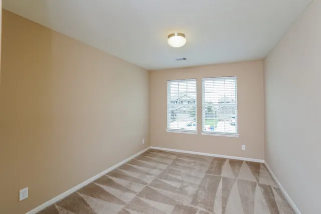 a view of an empty room and window