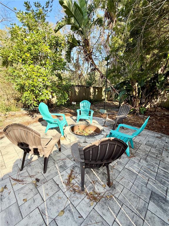 4848 Tampa Downs Boulevard Lutz, FL 33559 - Photo 25 of 27 a backyard of a house with table and chairs