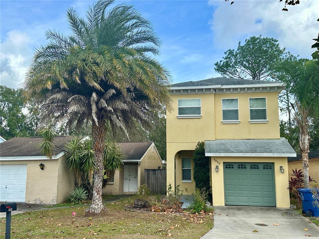 4848 Tampa Downs Boulevard Lutz, FL 33559 - Photo 27 of 27 a front view of a house with garden