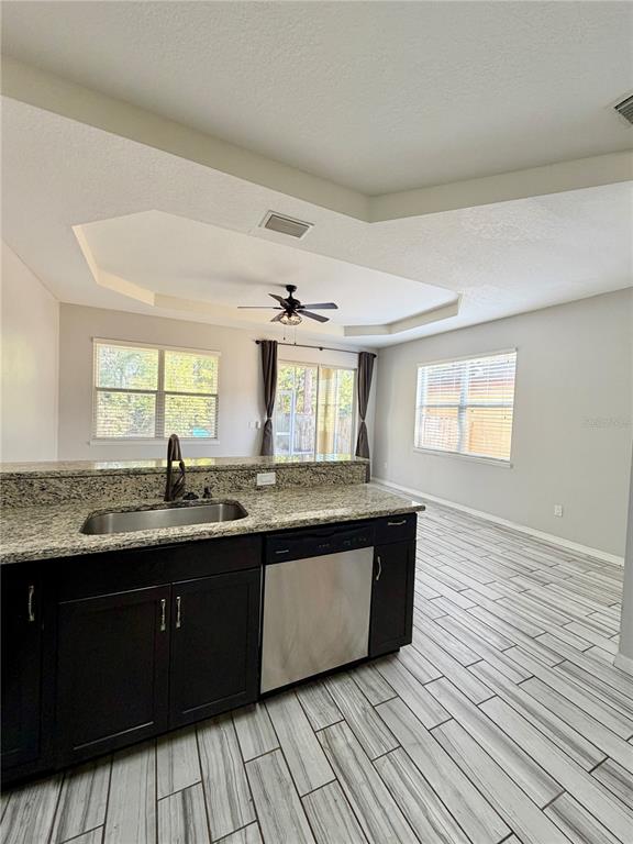 4848 Tampa Downs Boulevard Lutz, FL 33559 - Photo 4 of 27 a large kitchen with granite countertop a sink and cabinets