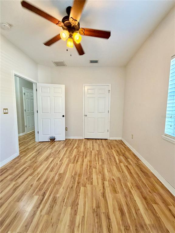 4848 Tampa Downs Boulevard Lutz, FL 33559 - Photo 10 of 27 a view of empty room with wooden floor