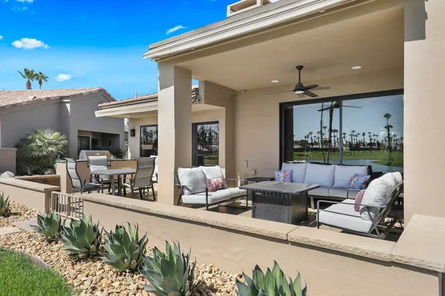 a lobby with furniture and garden view