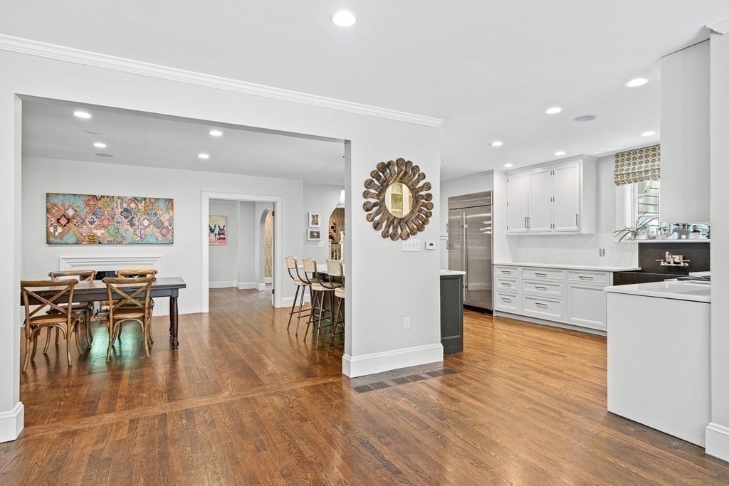 25 Emerson Road Wellesley, MA 02481 - Photo 12 of 42 an open kitchen with a table and chairs