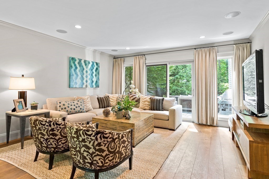 25 Emerson Road Wellesley, MA 02481 - Photo 24 of 42 a living room with furniture a large window and a flat screen tv