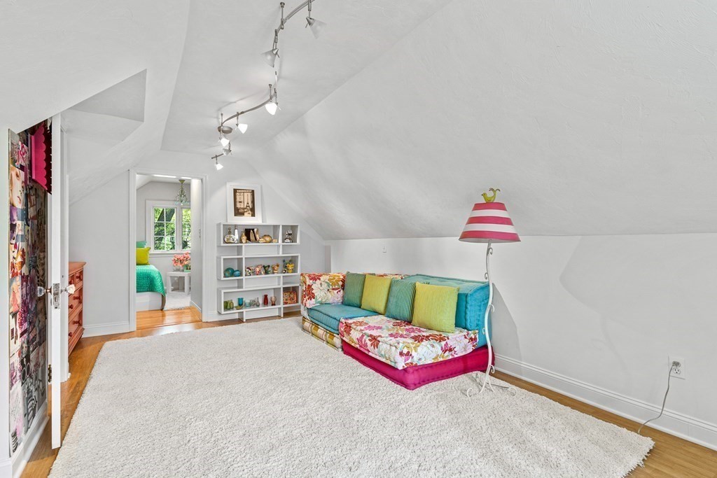 25 Emerson Road Wellesley, MA 02481 - Photo 32 of 42 a bedroom with furniture and a book shelf