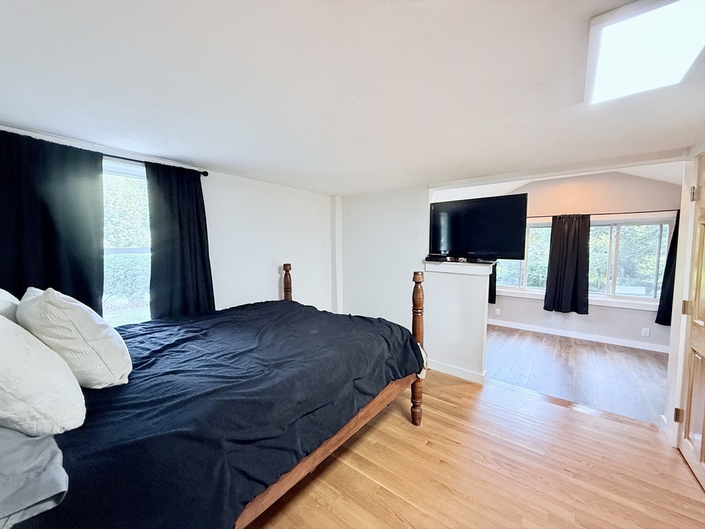 975 South Main Street Bellingham, MA 02019 - Photo 16 of 38 a bedroom with a bed and wooden floor