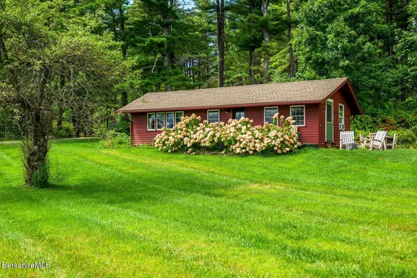 a backyard of a house with lots of green space