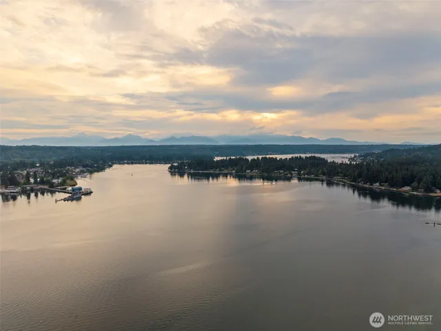 an aerial view of a house with a yard and garden