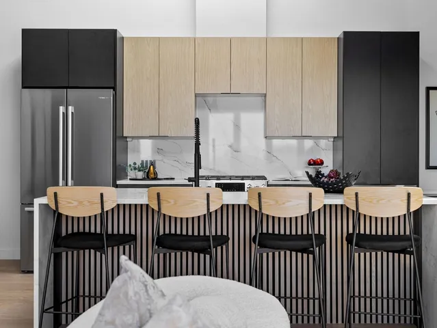 a view of a kitchen with a sink and cabinets