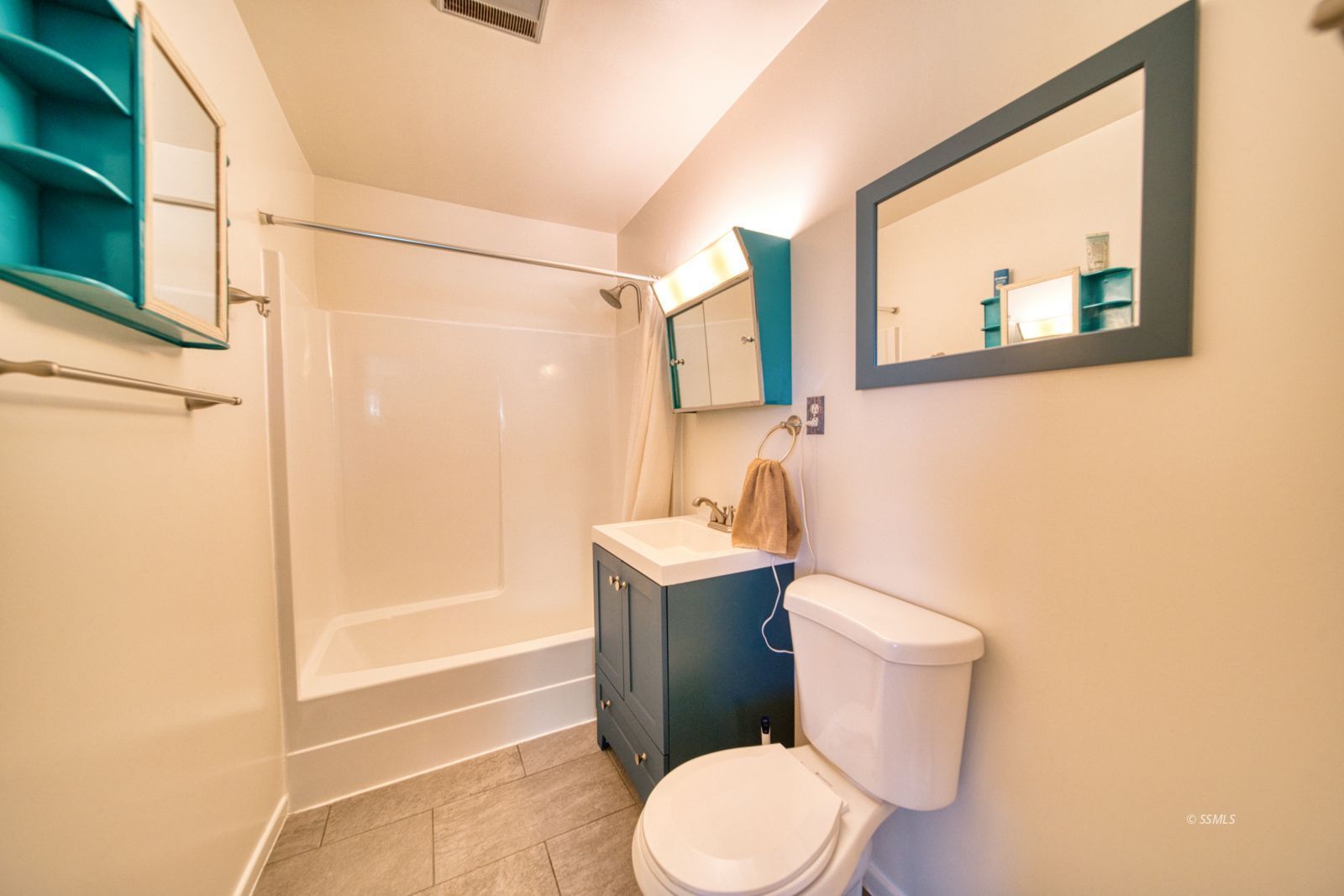 4047 Felspar Avenue Ridgecrest, CA 93555 - Photo 30 of 49 a white toilet sitting next to a bathroom sink