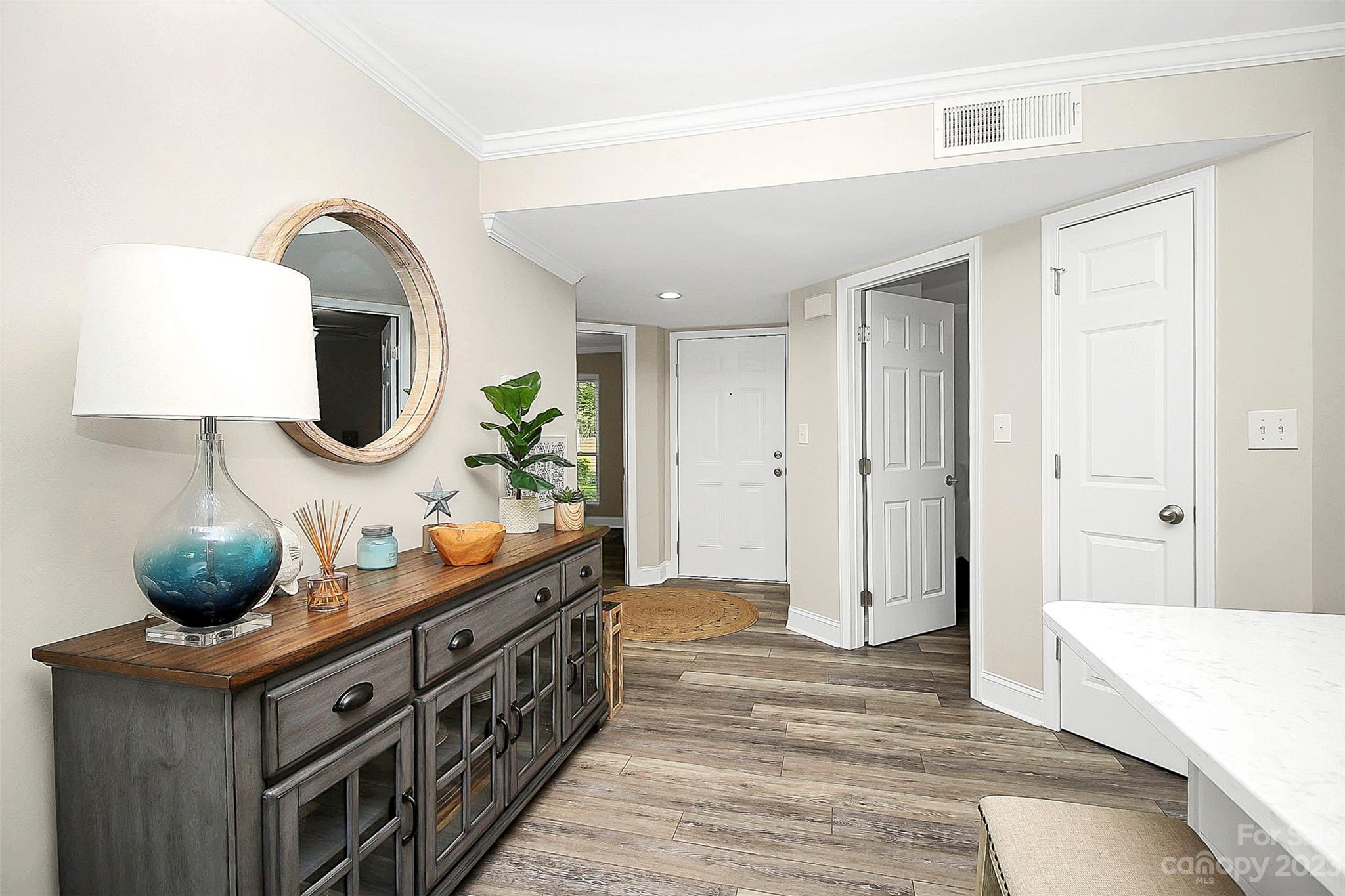 205 Northwest Drive, Unit 38 Davidson, NC 28036 - Photo 11 of 32 a kitchen with stainless steel appliances granite countertop a stove and a wooden floor