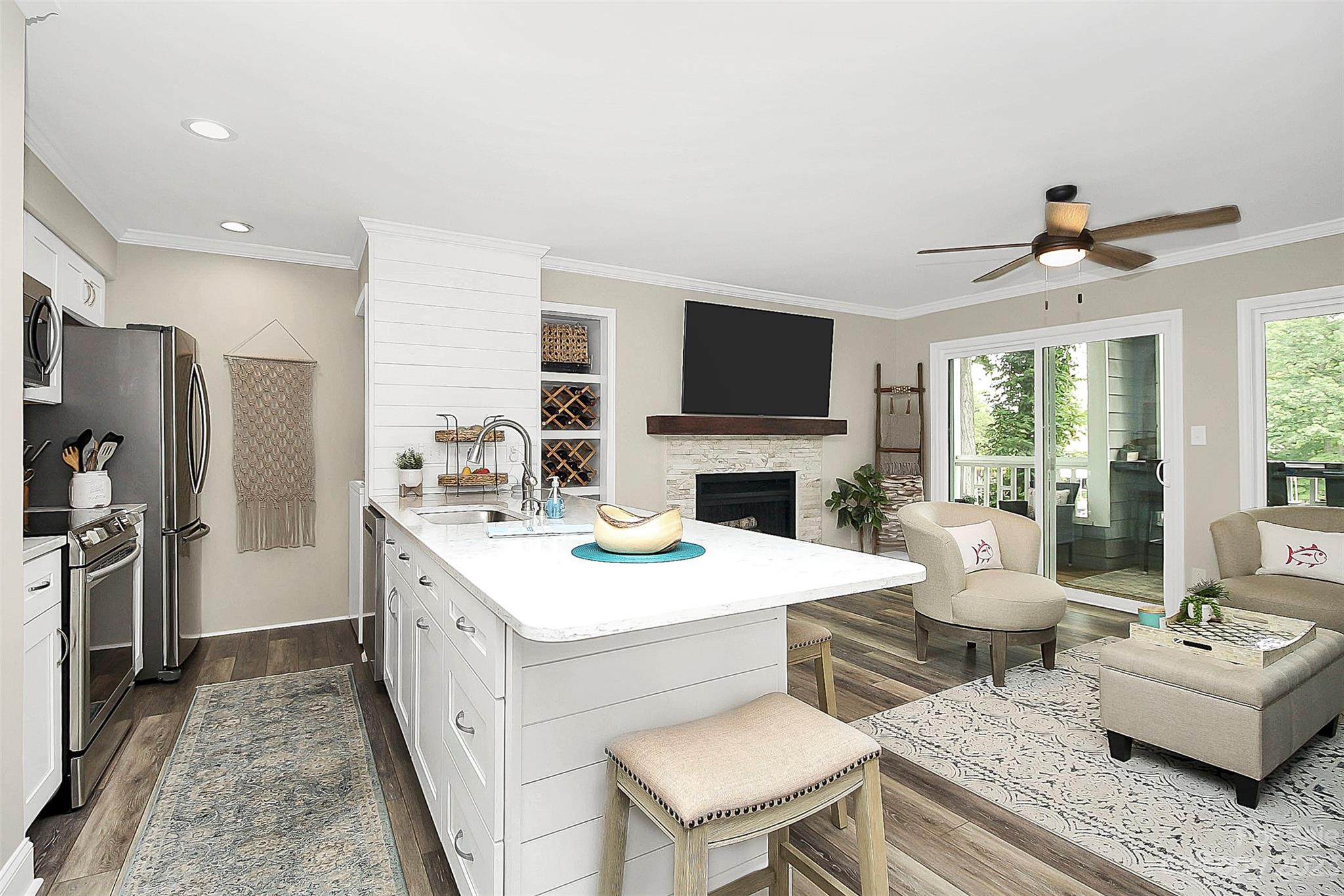 205 Northwest Drive, Unit 38 Davidson, NC 28036 - Photo 13 of 32 a living room with furniture a fireplace and a flat screen tv