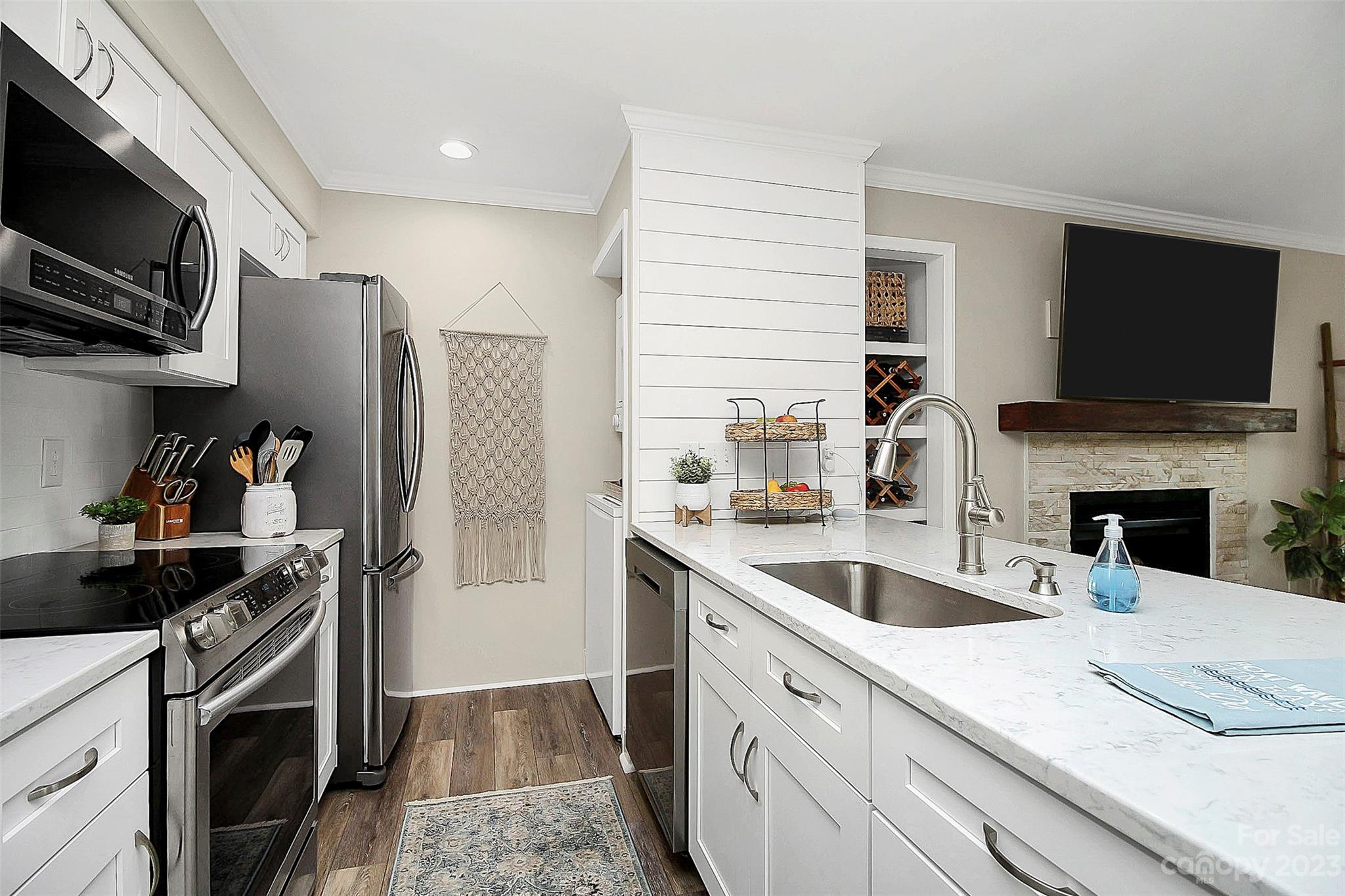 205 Northwest Drive, Unit 38 Davidson, NC 28036 - Photo 14 of 32 a kitchen with stainless steel appliances granite countertop a sink and a stove