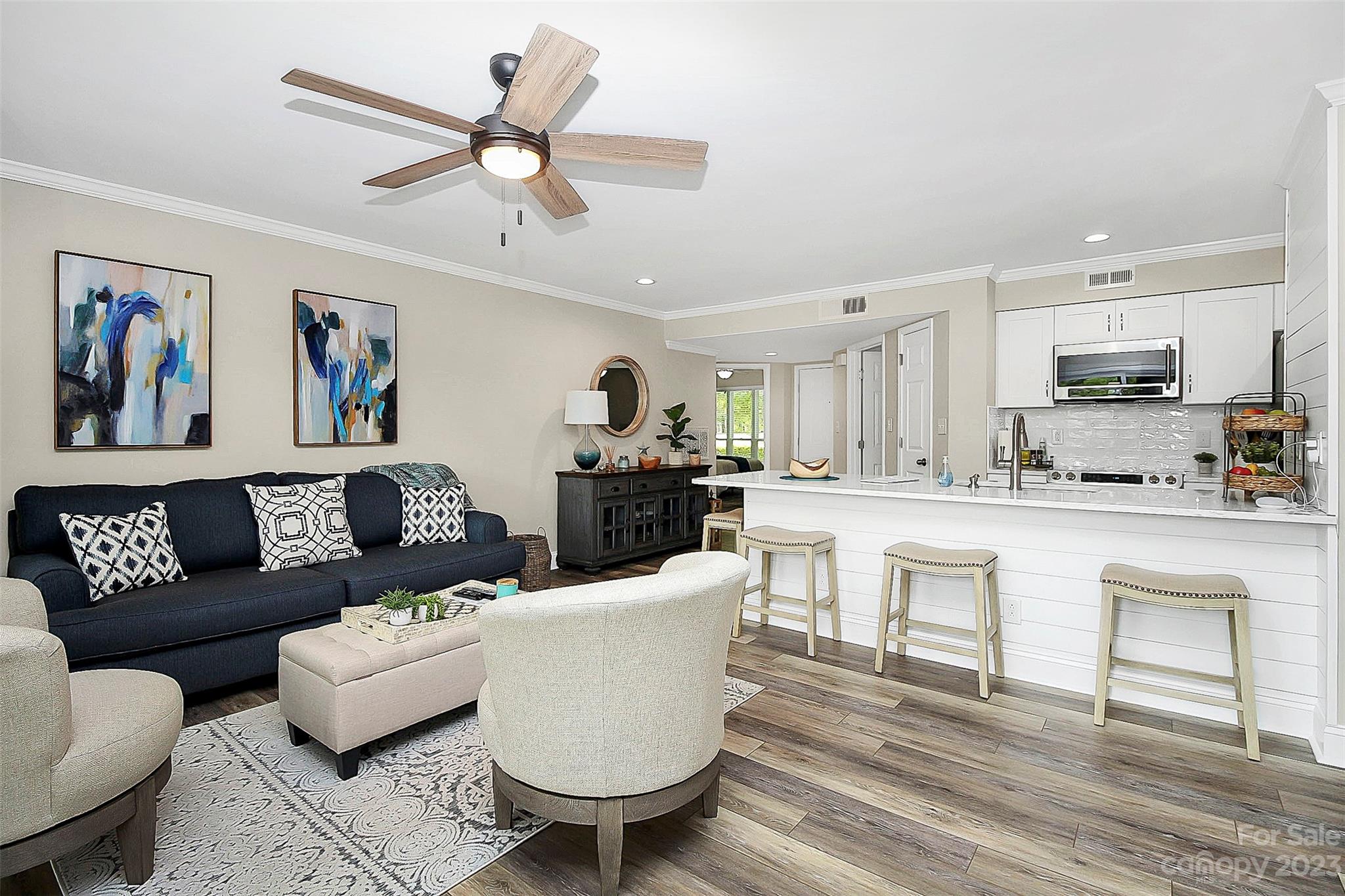 205 Northwest Drive, Unit 38 Davidson, NC 28036 - Photo 21 of 32 a living room with furniture and kitchen view