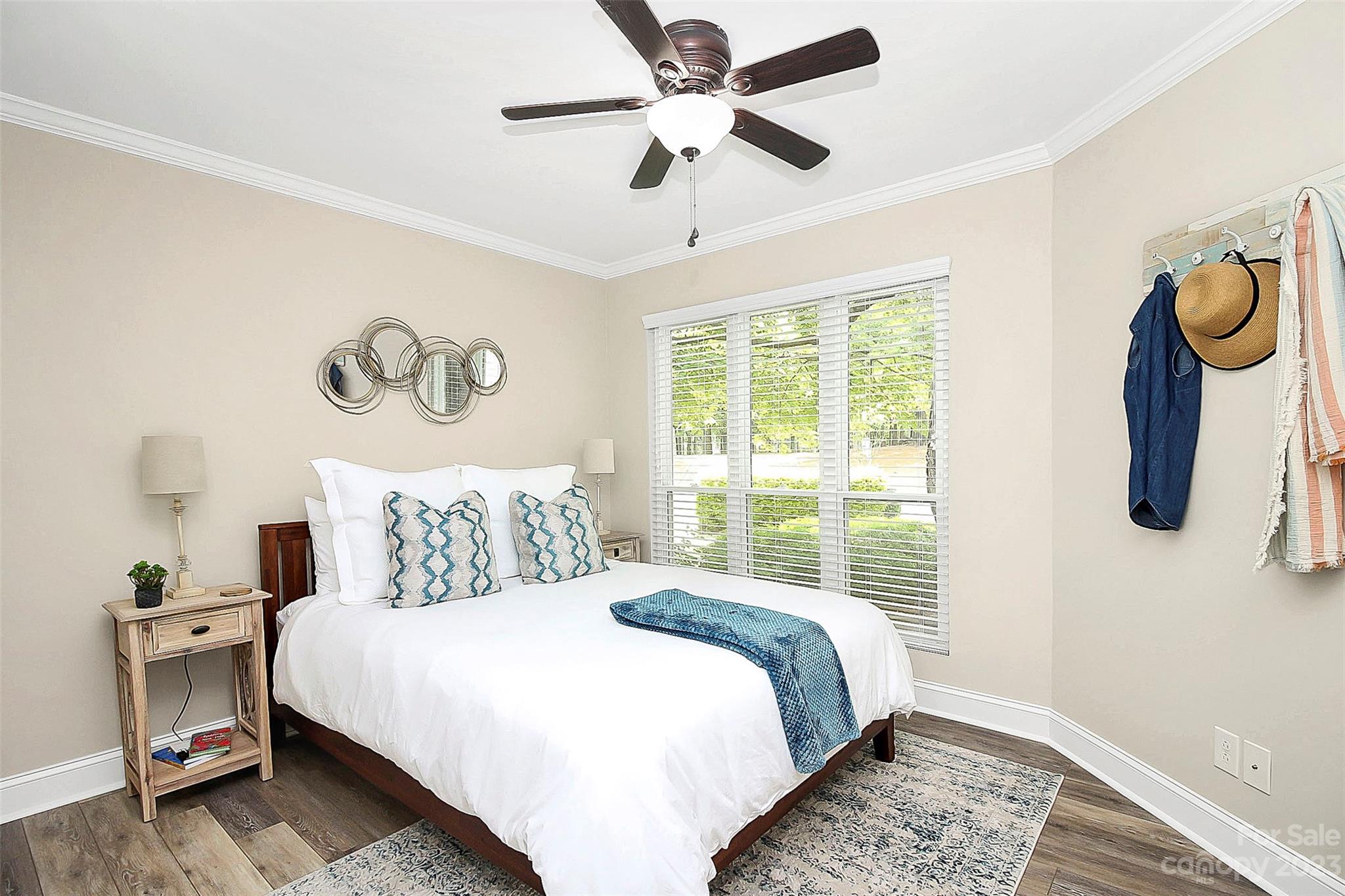 205 Northwest Drive, Unit 38 Davidson, NC 28036 - Photo 5 of 32 a bedroom with a bed and a window