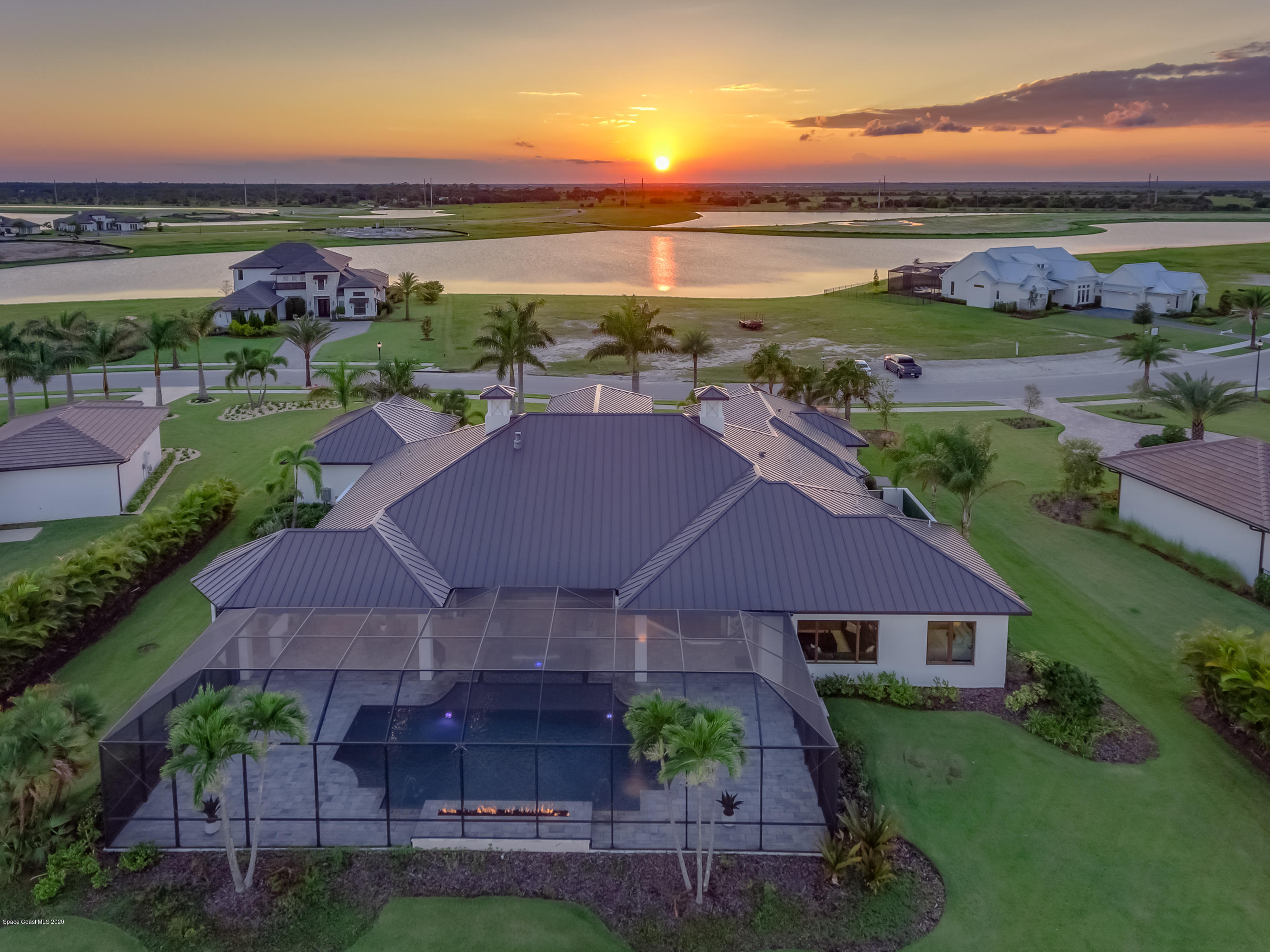 4533 Milost Drive Rockledge, FL 32955 - Photo 2 of 49 an aerial view of a house with garden space and ocean view