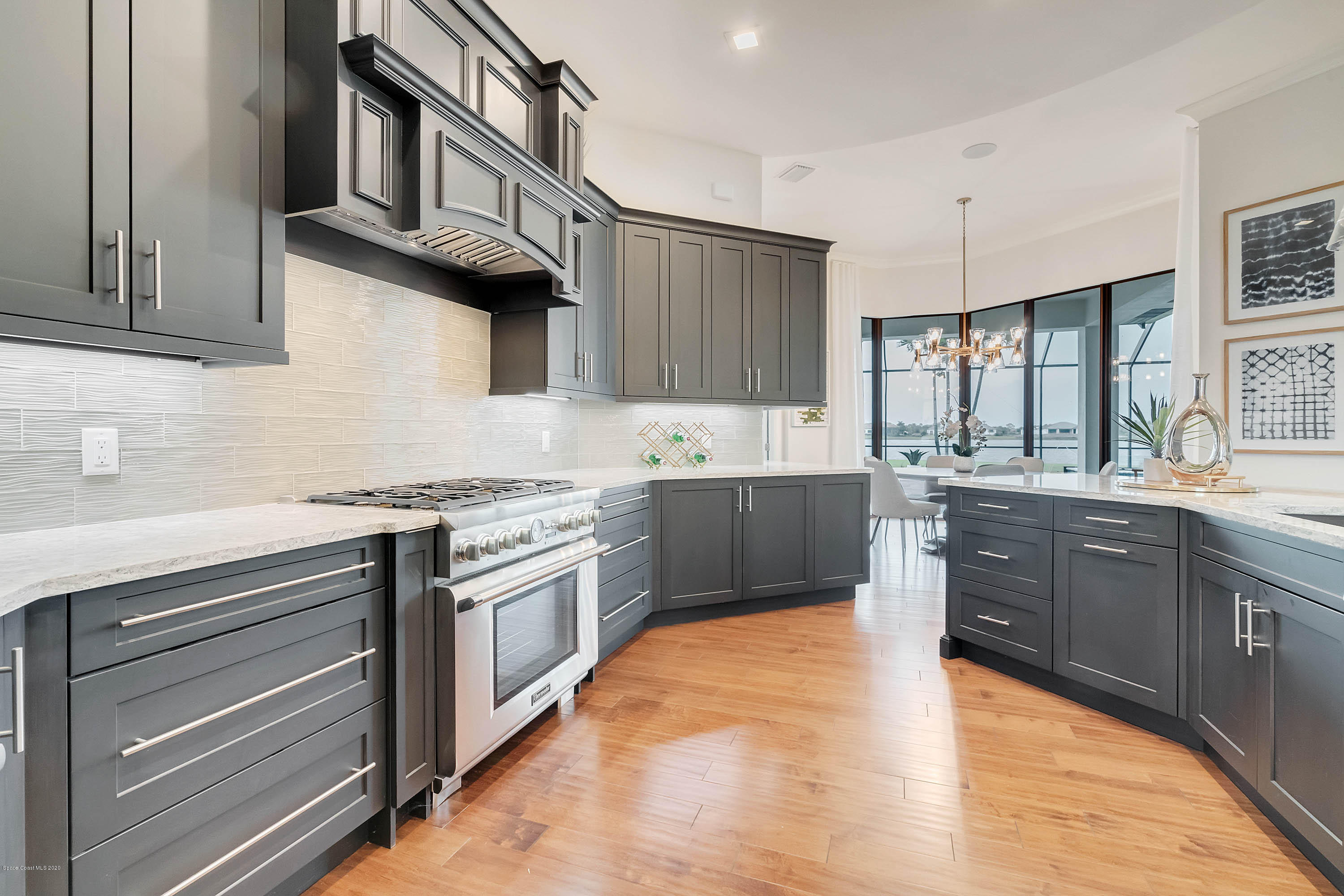 4533 Milost Drive Rockledge, FL 32955 - Photo 11 of 49 a kitchen with stainless steel appliances granite countertop a sink a stove and a refrigerator