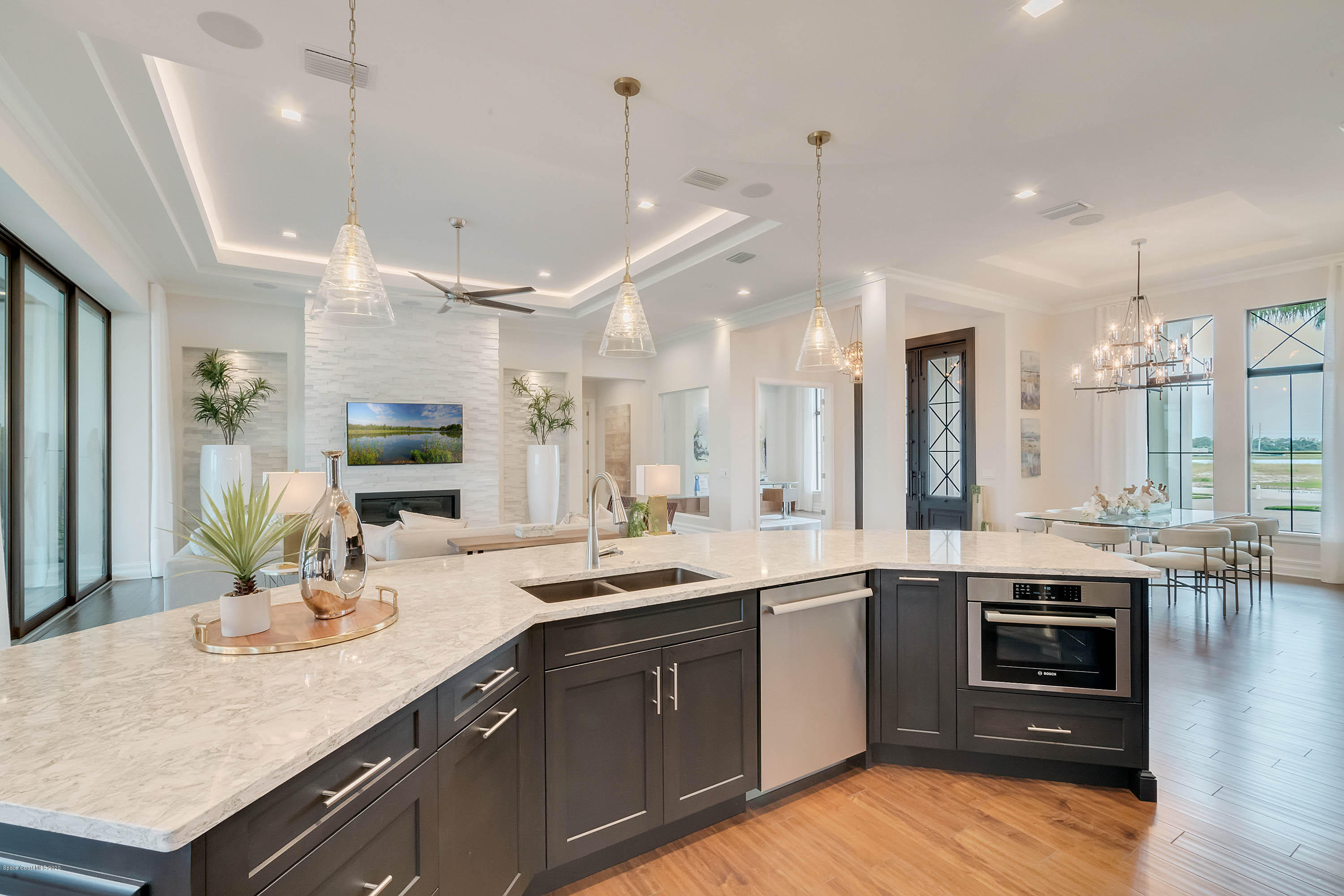 4533 Milost Drive Rockledge, FL 32955 - Photo 12 of 49 a kitchen with a sink a stove and chairs