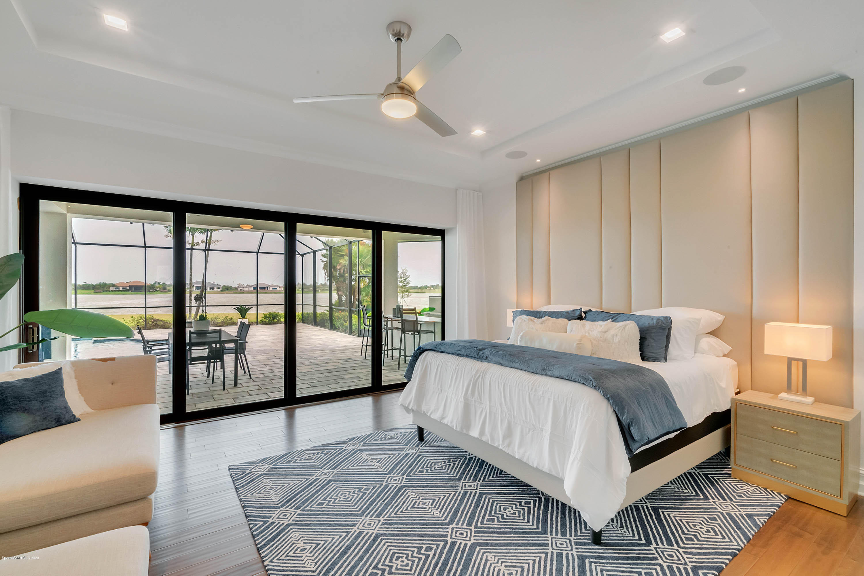 4533 Milost Drive Rockledge, FL 32955 - Photo 14 of 49 a bedroom with a large bed and a large window