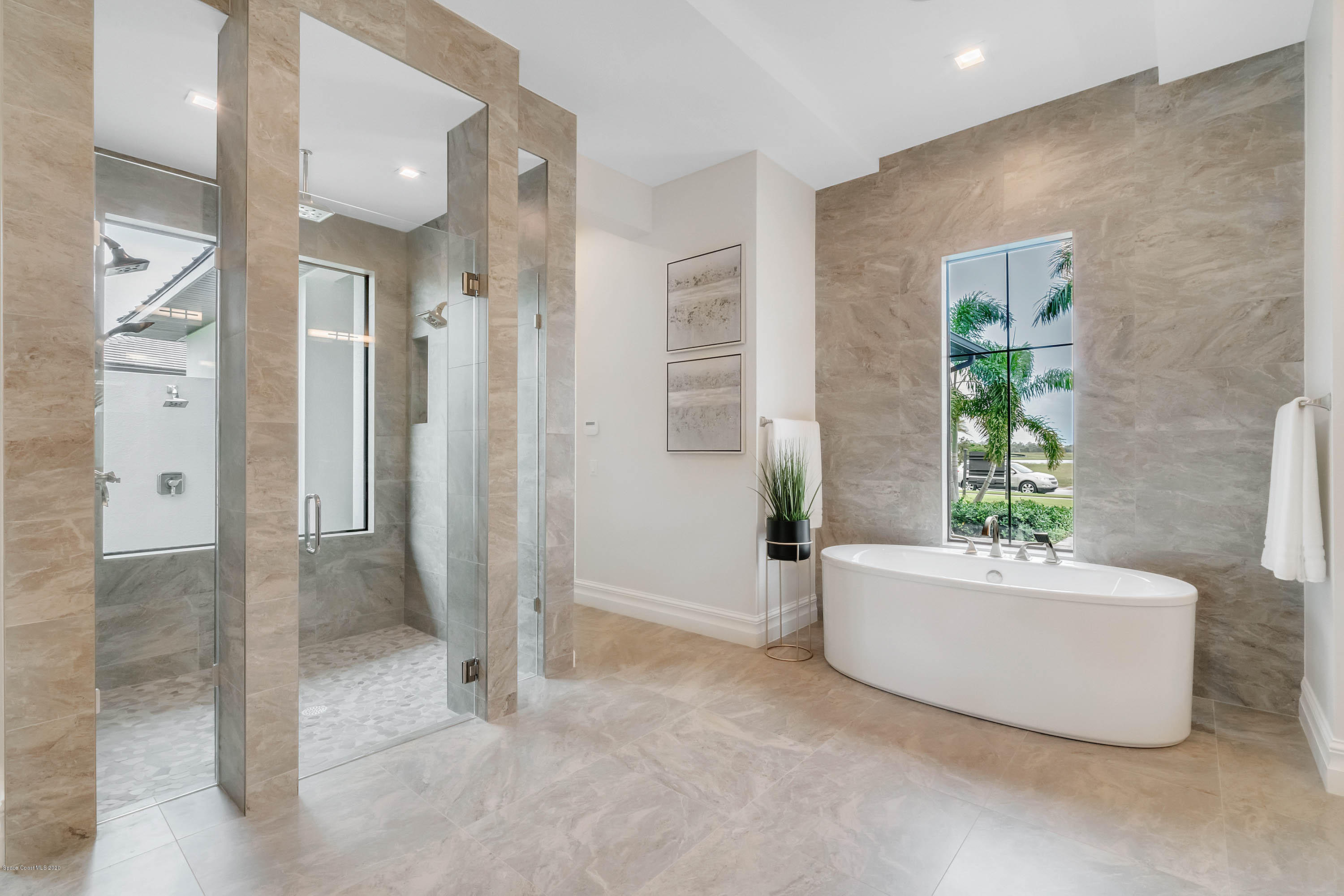 4533 Milost Drive Rockledge, FL 32955 - Photo 17 of 49 a bathroom with a bathtub and shower