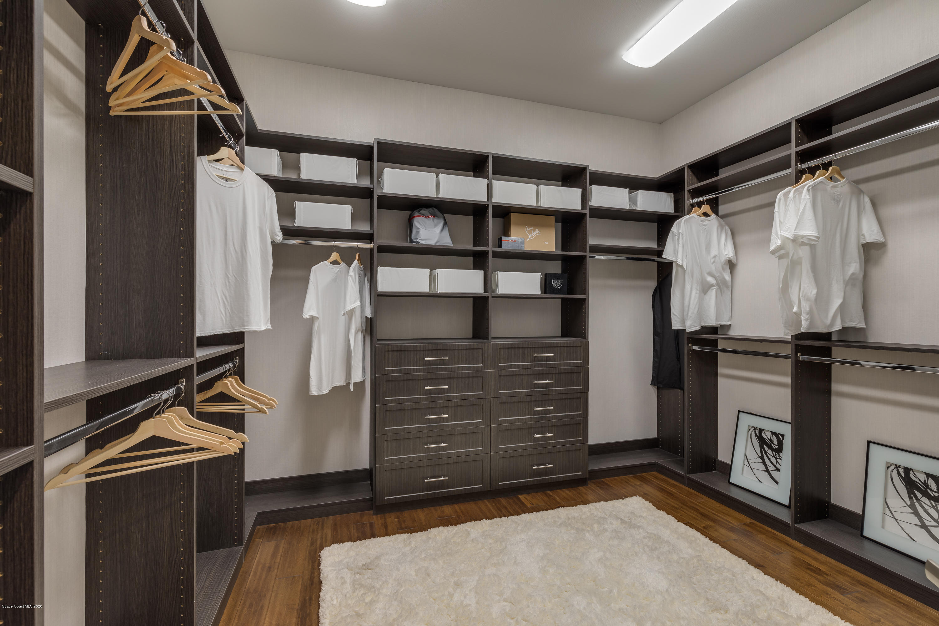 4533 Milost Drive Rockledge, FL 32955 - Photo 18 of 49 a view of walk in closet with clothes and shoes