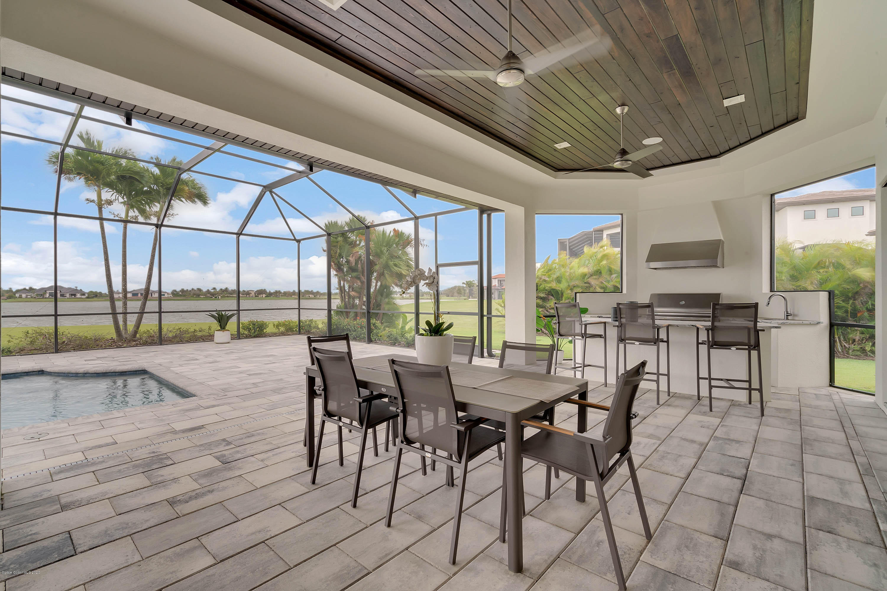 4533 Milost Drive Rockledge, FL 32955 - Photo 23 of 49 a view of a patio with dining table and chairs