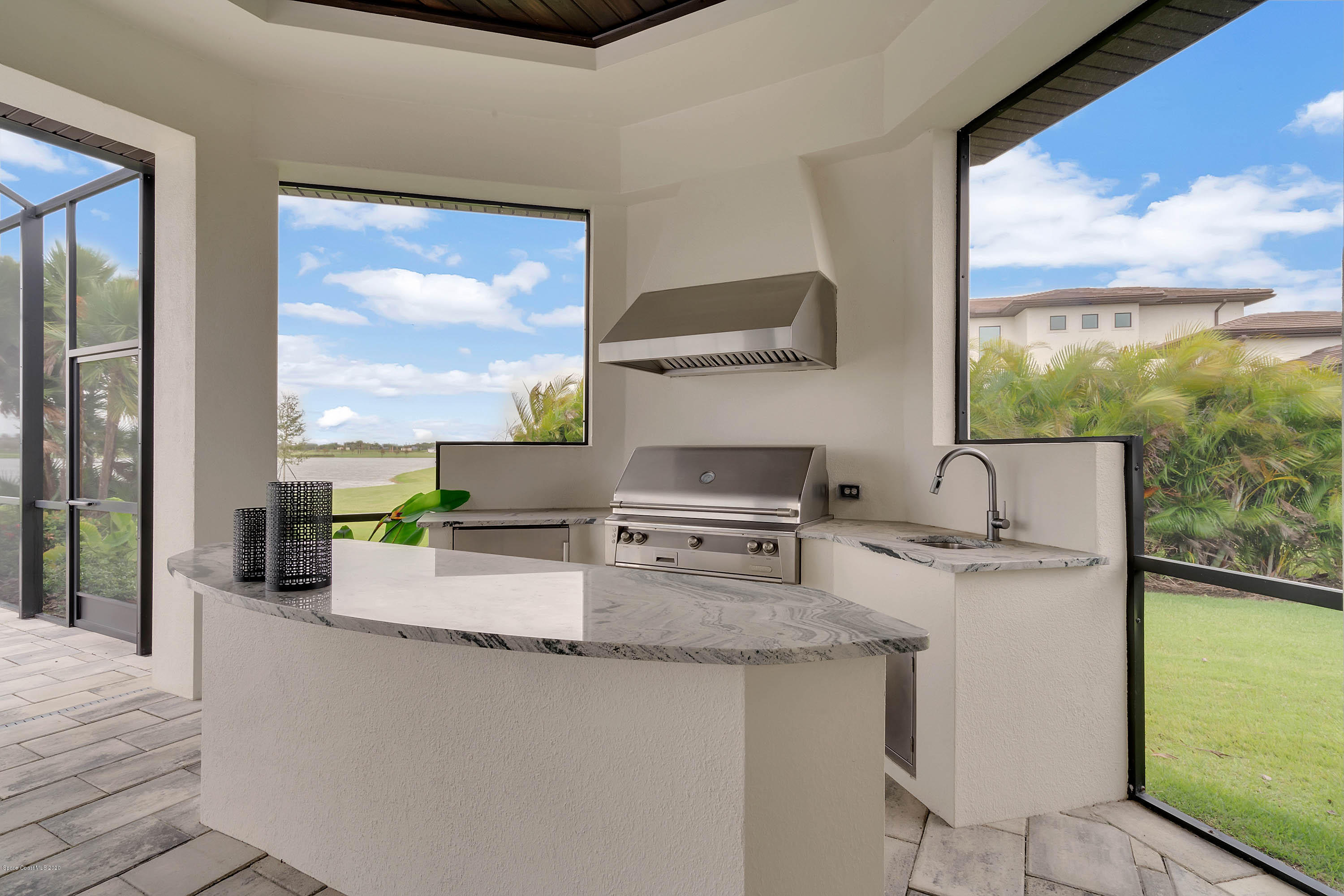 4533 Milost Drive Rockledge, FL 32955 - Photo 24 of 49 a kitchen with stainless steel appliances granite countertop sink stove and refrigerator
