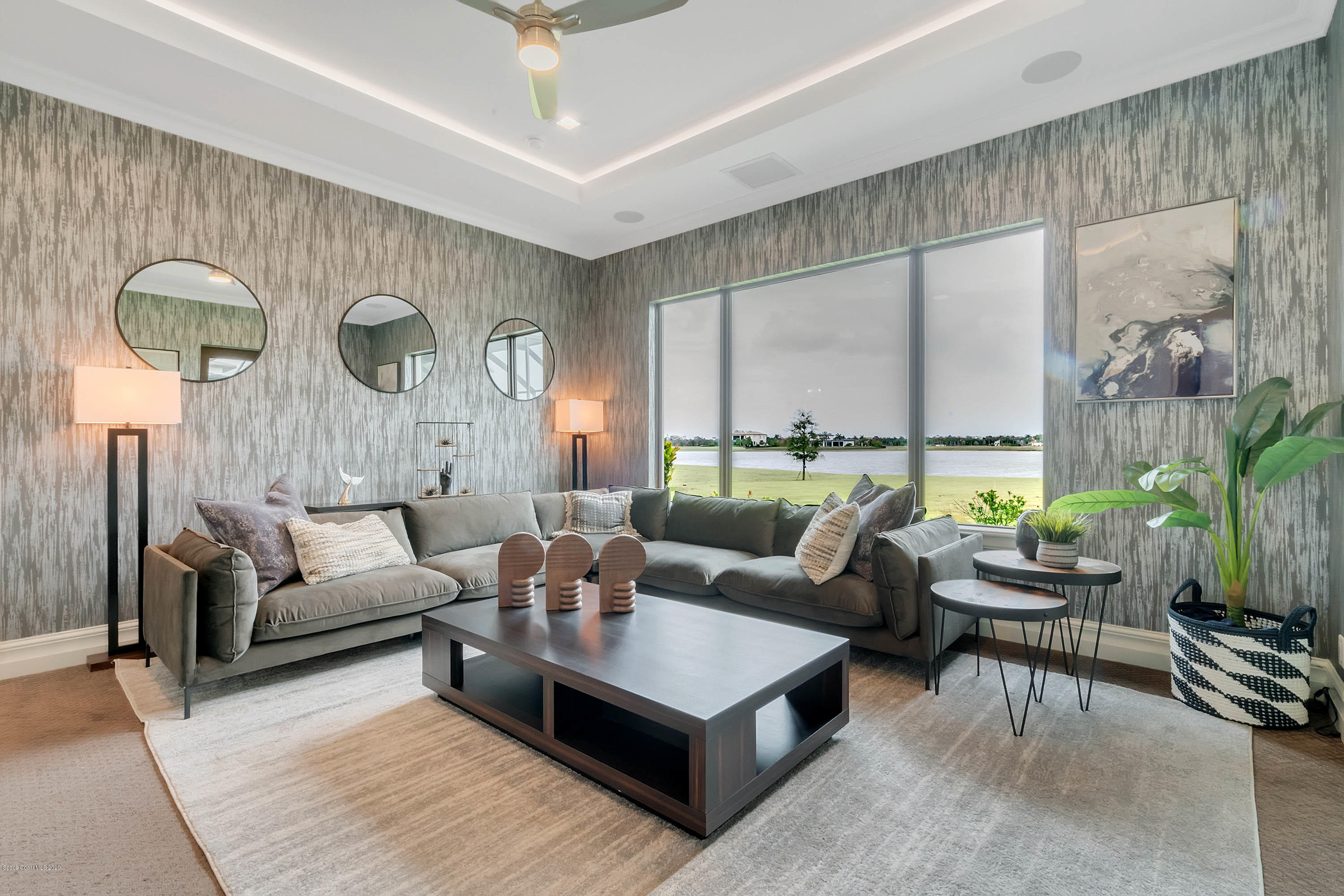 4533 Milost Drive Rockledge, FL 32955 - Photo 26 of 49 a living room with furniture and a large window