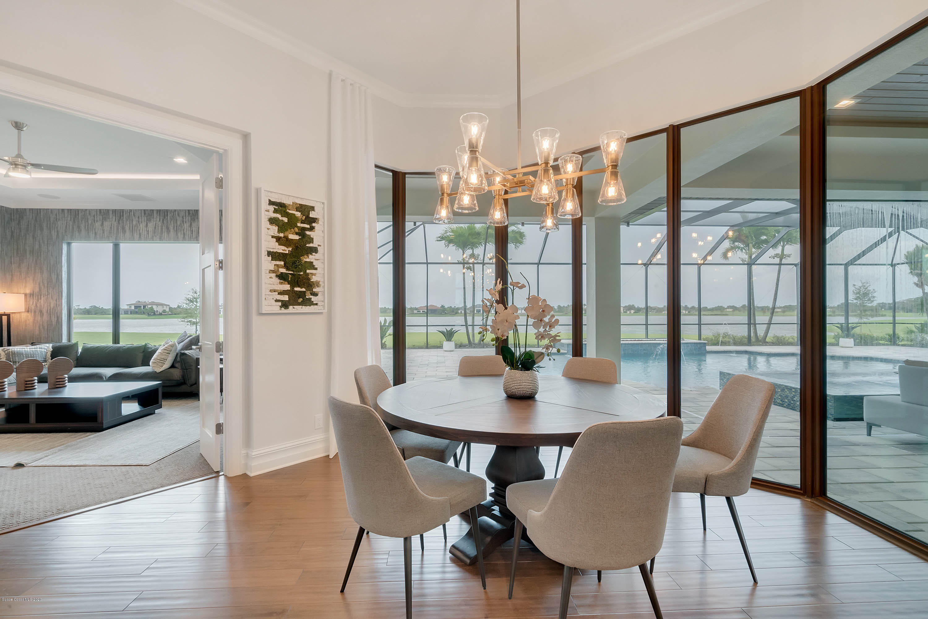 4533 Milost Drive Rockledge, FL 32955 - Photo 34 of 49 a view of a dining room with furniture window and wooden floor
