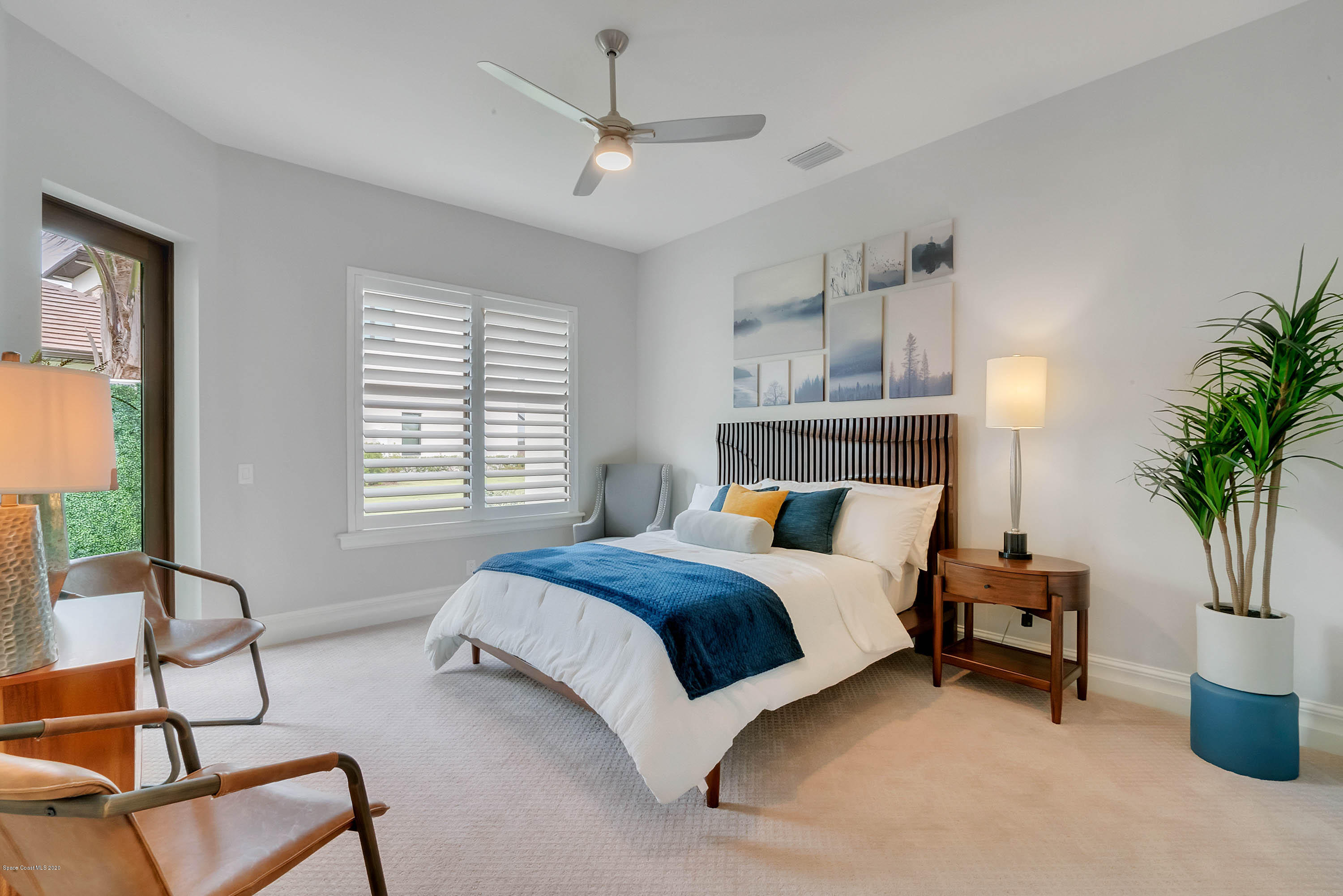 4533 Milost Drive Rockledge, FL 32955 - Photo 41 of 49 a bed room with a bed and a potted plant