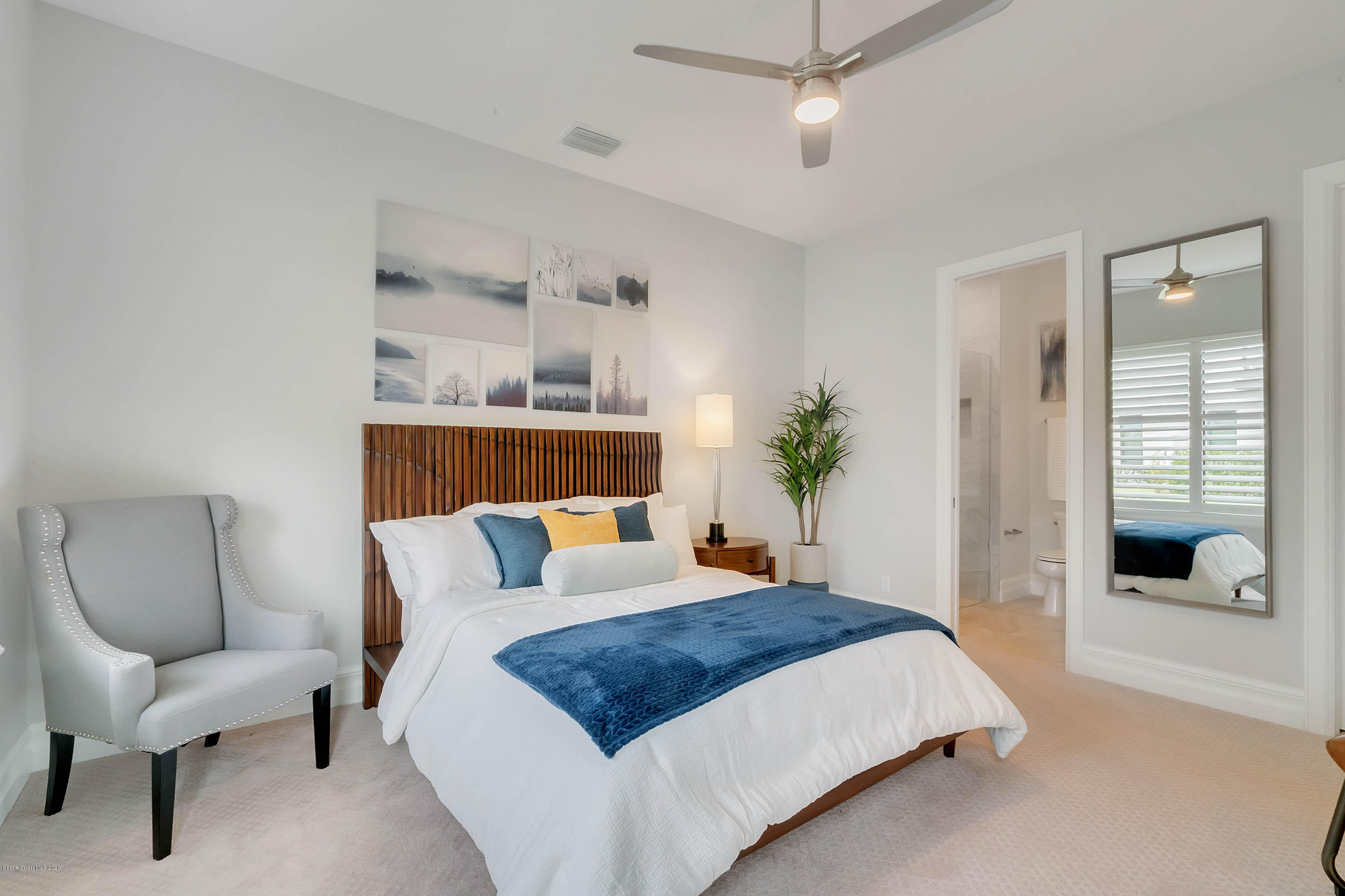 4533 Milost Drive Rockledge, FL 32955 - Photo 42 of 49 a bedroom with a large bed and a couch