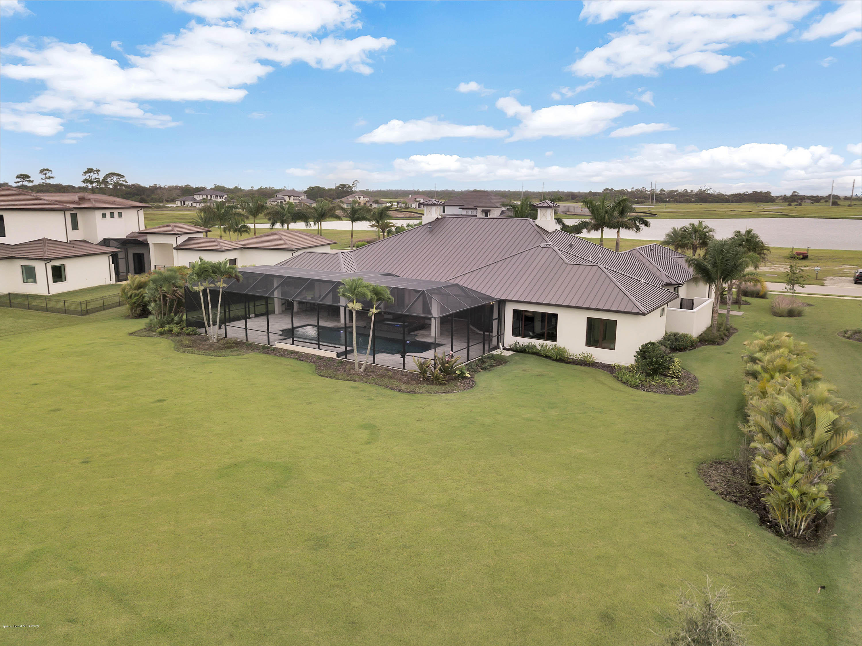 4533 Milost Drive Rockledge, FL 32955 - Photo 46 of 49 aerial view of a house with a big yard and large trees
