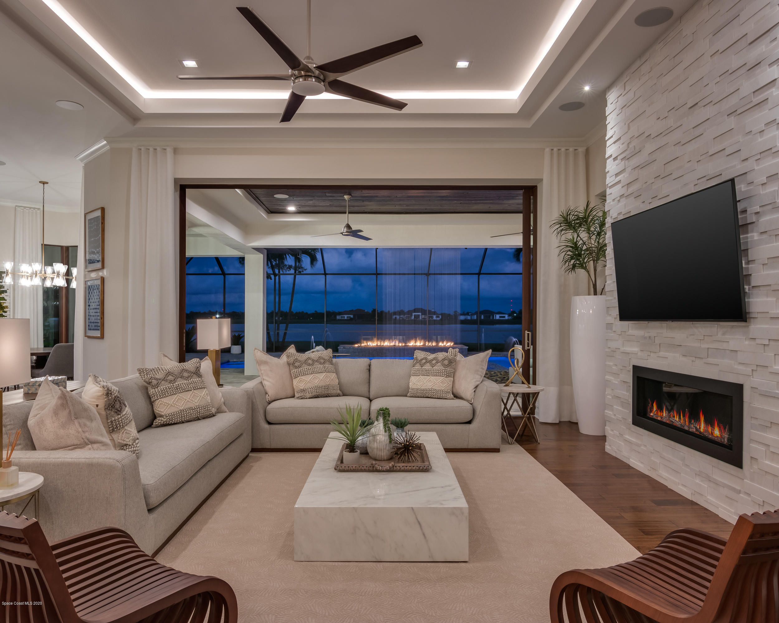 4533 Milost Drive Rockledge, FL 32955 - Photo 6 of 49 a living room with furniture and a fireplace