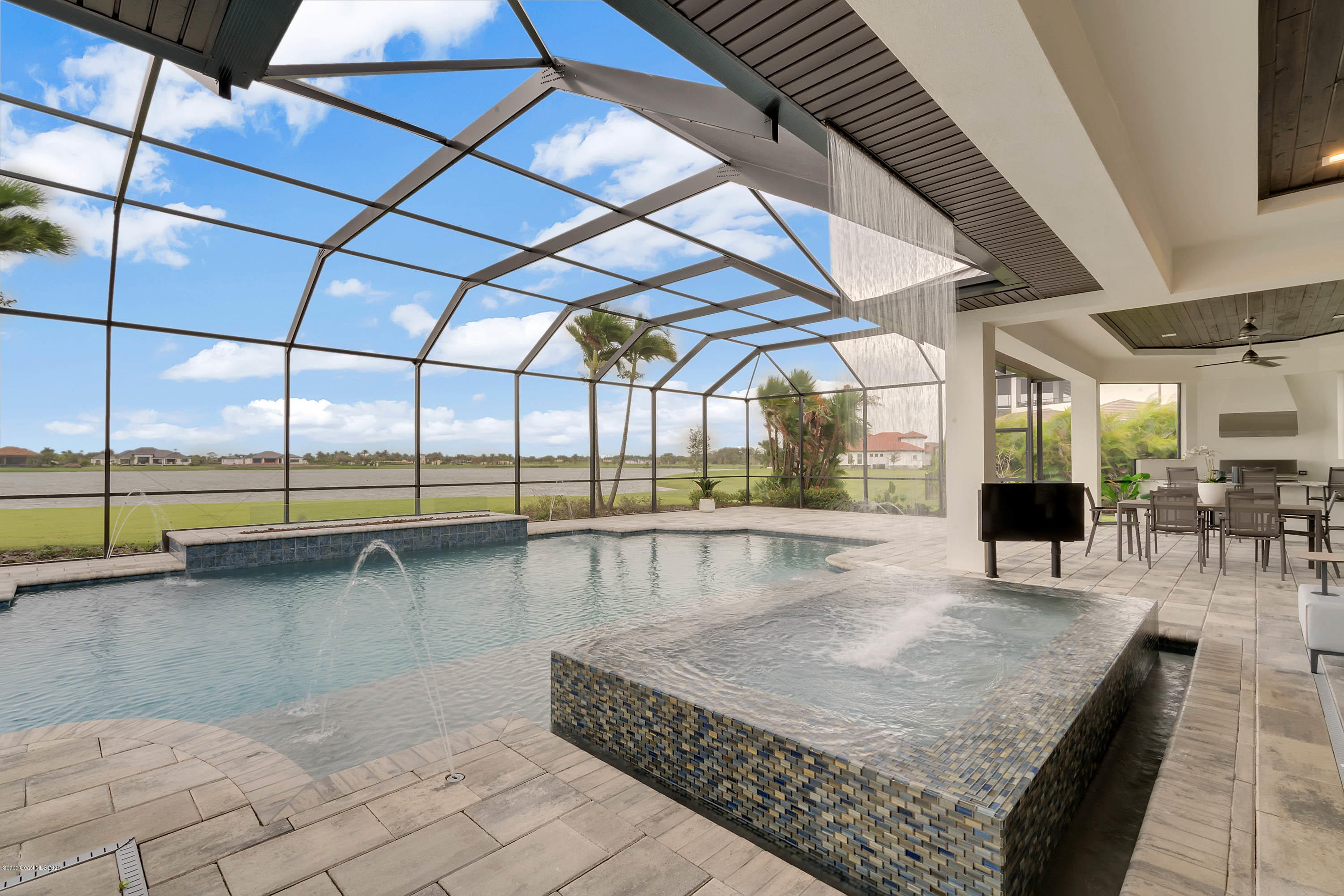 4533 Milost Drive Rockledge, FL 32955 - Photo 7 of 49 a view of a swimming pool with outdoor seating
